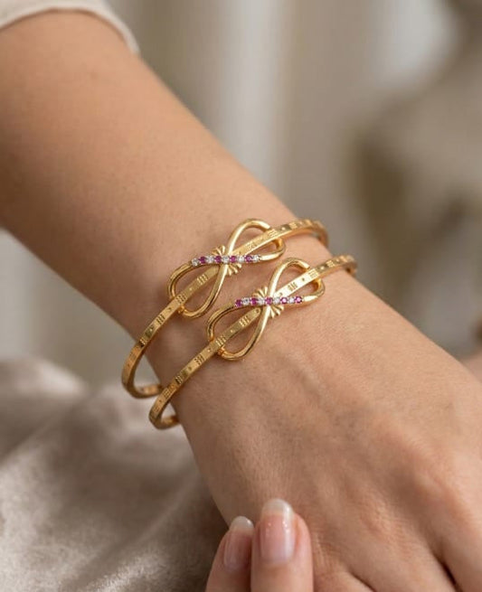 Elegant Infinity Bow Micro Gold Plated Ruby And Designer Bangles (Set Of 2)