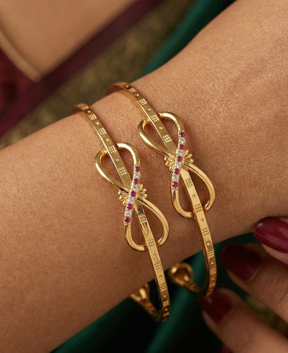 Elegant Infinity Bow Micro Gold Plated Ruby And Designer Bangles (Set Of 2)