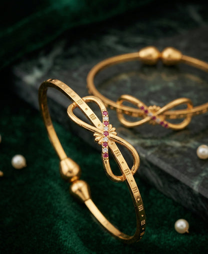 Elegant Infinity Bow Micro Gold Plated Ruby And Designer Bangles (Set Of 2)